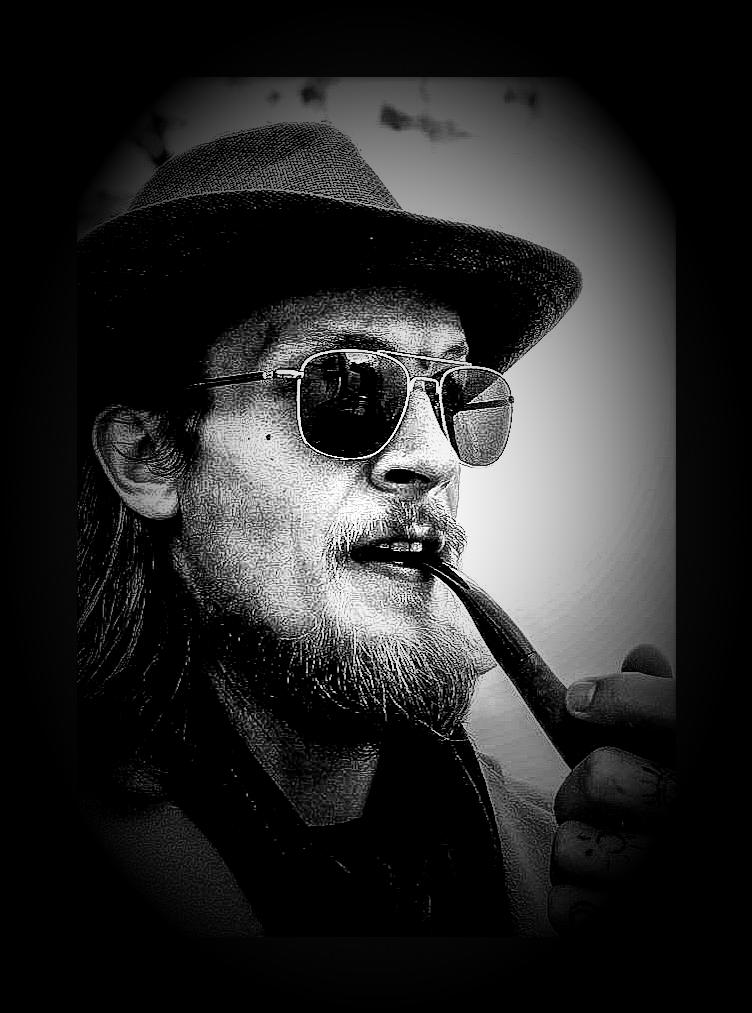 Approved black-and-white portrait of M. J. Stokknes wearing a hat and sunglasses